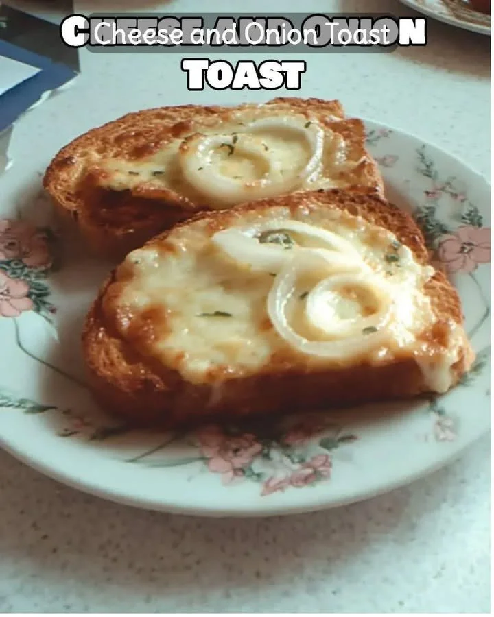 Delicious cheese and onion toast topped with melted cheese and fresh herbs