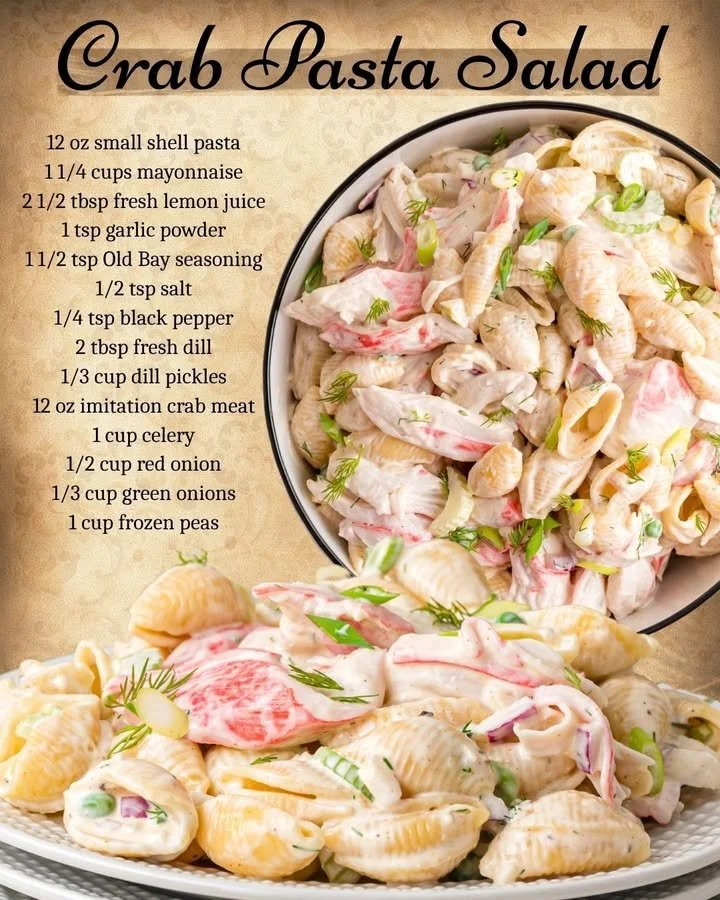 Fresh crab pasta salad garnished with herbs and vegetables