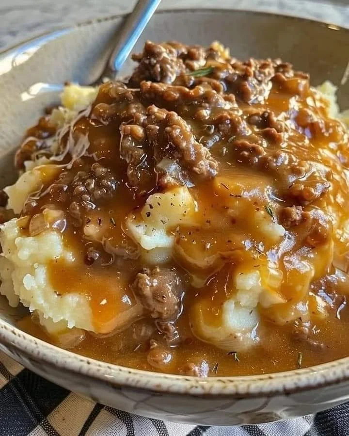 Ground beef and gravy dish served over mashed potatoes