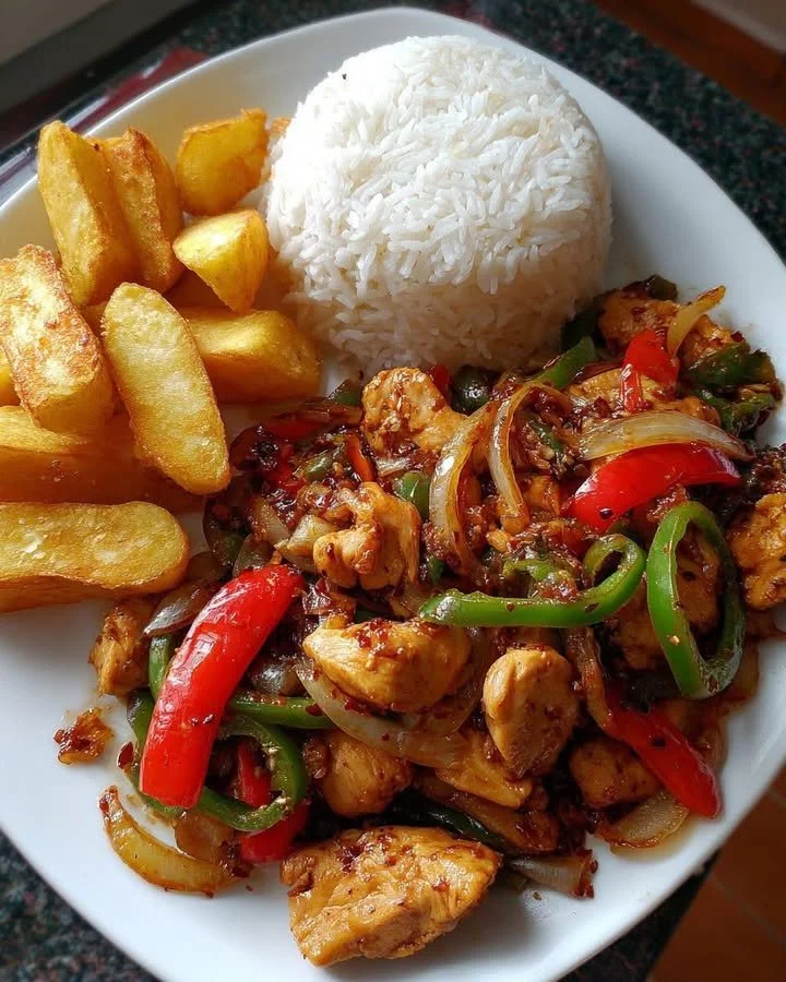 Spicy Chicken Stir-Fry served with rice and chunky potato wedges